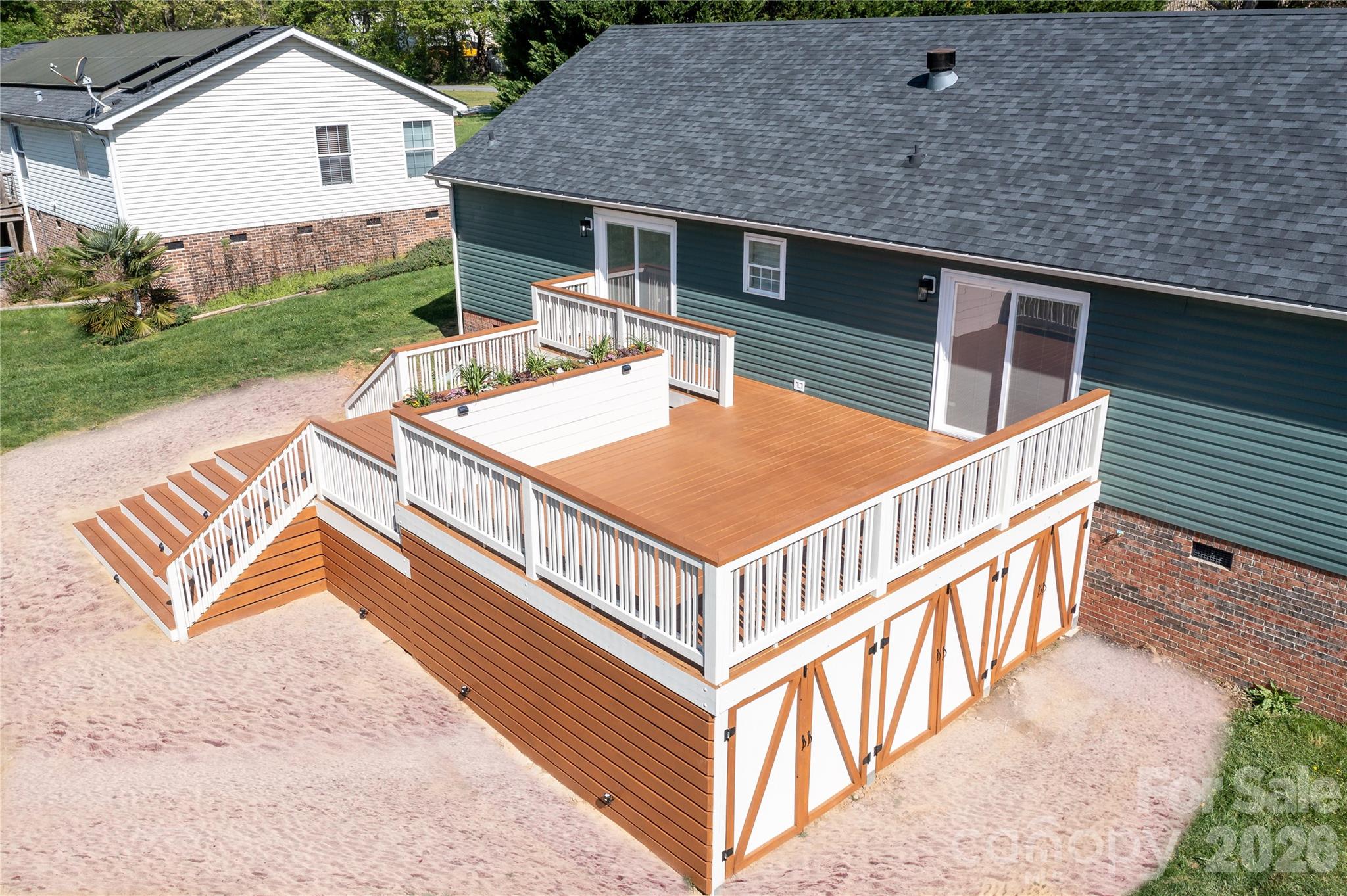 7858 Blackwood Road Denver, NC 28037 - Photo 3 of 11 a view of a house with a deck and a yard