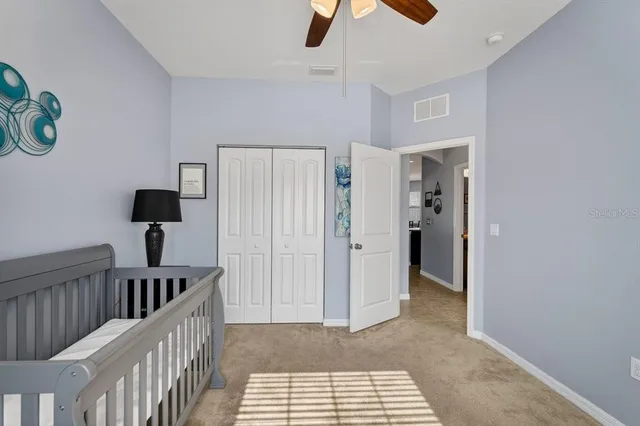 a view of a hallway with windows and stairs
