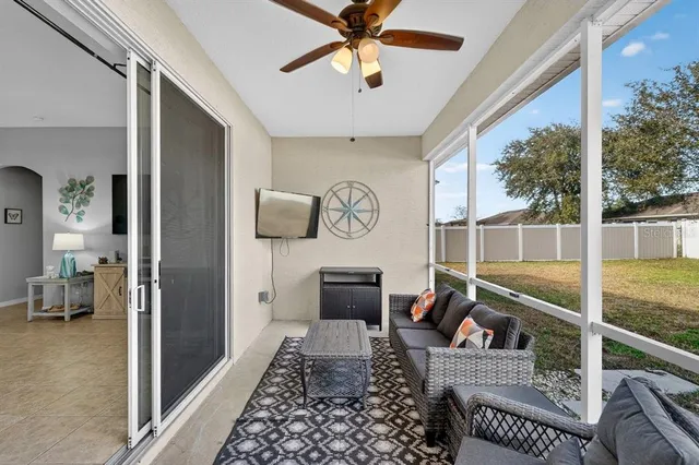 a living room with furniture and a table