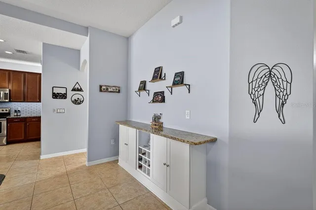 a kitchen with cabinets and window