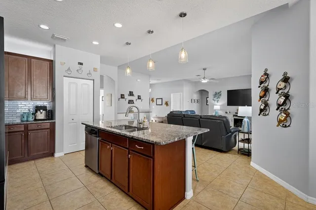 a kitchen with stainless steel appliances granite countertop lots of counter top space