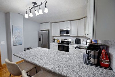 87 Snowbird Road Robbinsville, NC 28771 - Photo 11 of 40 a kitchen with stainless steel appliances granite countertop a sink dishwasher stove refrigerator and cabinets
