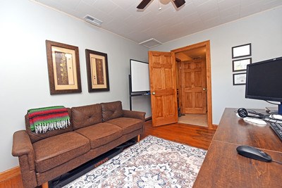 87 Snowbird Road Robbinsville, NC 28771 - Photo 14 of 40 a living room with furniture and a flat screen tv