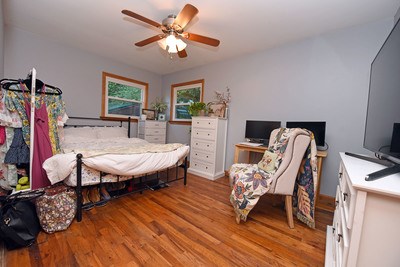 87 Snowbird Road Robbinsville, NC 28771 - Photo 16 of 40 a dining room with furniture a chandelier and wooden floor