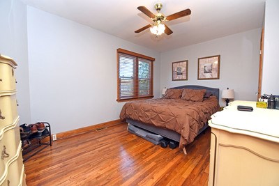 87 Snowbird Road Robbinsville, NC 28771 - Photo 17 of 40 a bedroom with a bed and a chandelier