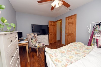87 Snowbird Road Robbinsville, NC 28771 - Photo 24 of 40 a bedroom with a bed and a chandelier