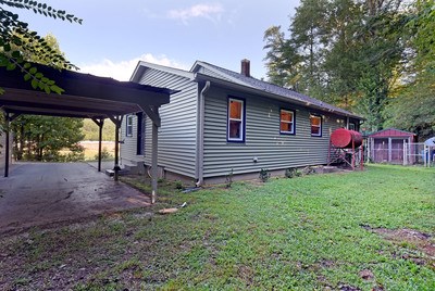 87 Snowbird Road Robbinsville, NC 28771 - Photo 32 of 40 a front view of a house with garden