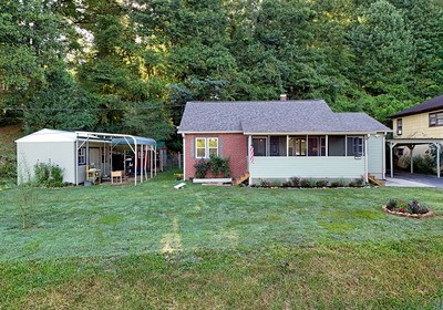 87 Snowbird Road Robbinsville, NC 28771 - Photo 33 of 40 a house view with a garden space
