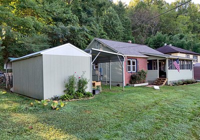 87 Snowbird Road Robbinsville, NC 28771 - Photo 39 of 40 a view of a house with backyard and garden