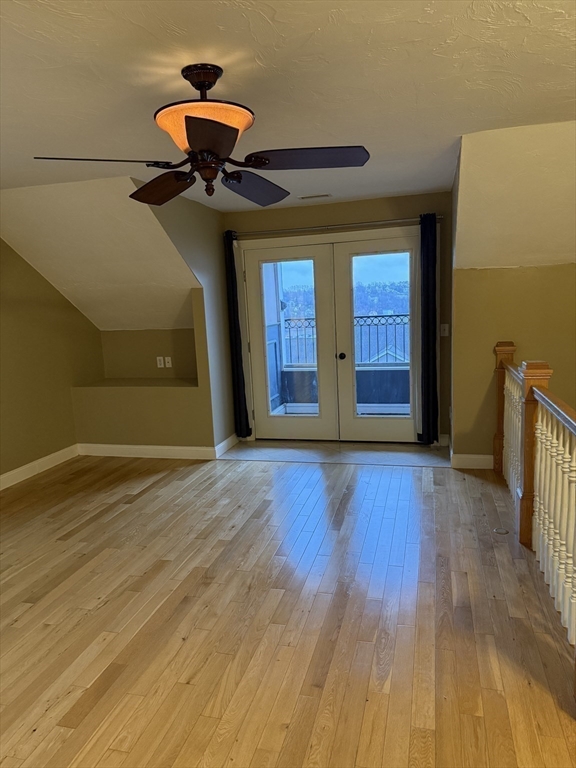 30 Johnson Street, Unit 1 Worcester, MA 01604 - Photo 17 of 24 a view of a room with wooden floor and chandelier