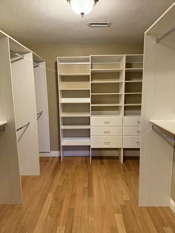 30 Johnson Street, Unit 1 Worcester, MA 01604 - Photo 20 of 24 a view of walk in closet with empty racks