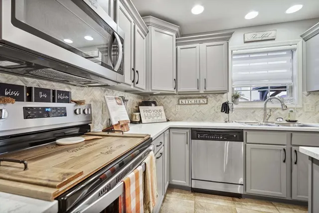 a kitchen with a stove and a sink