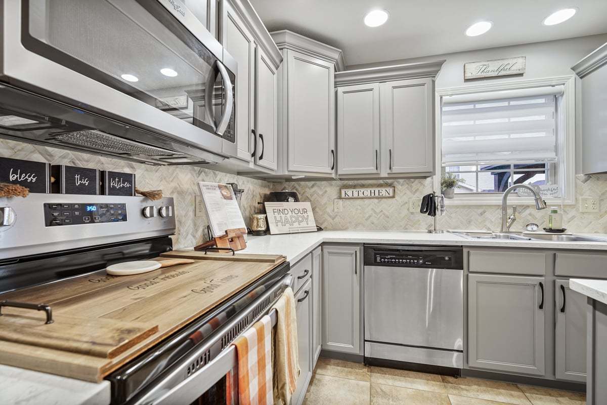 905 Dresser Drive Normal, IL 61761 - Photo 14 of 38 a kitchen with a stove and a sink