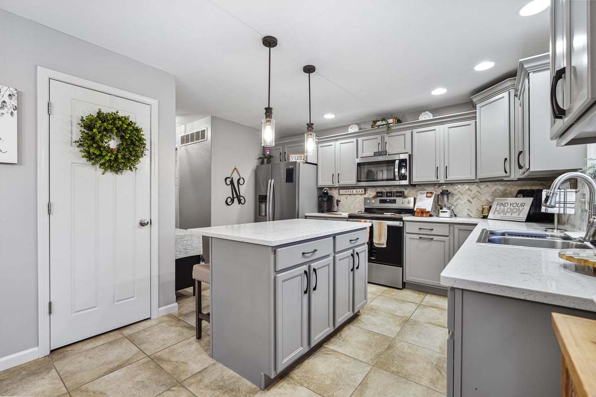 905 Dresser Drive Normal, IL 61761 - Photo 16 of 38 a kitchen with a sink and refrigerator