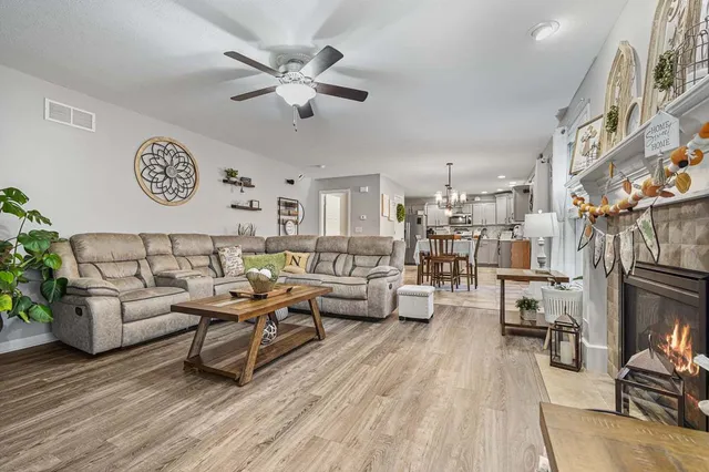 a living room with furniture and a fireplace