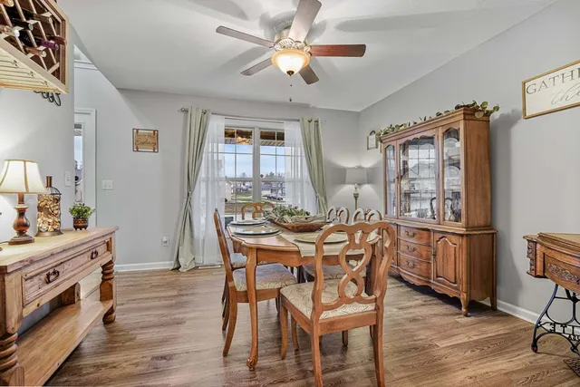 a view of a dining room with furniture and chandelier