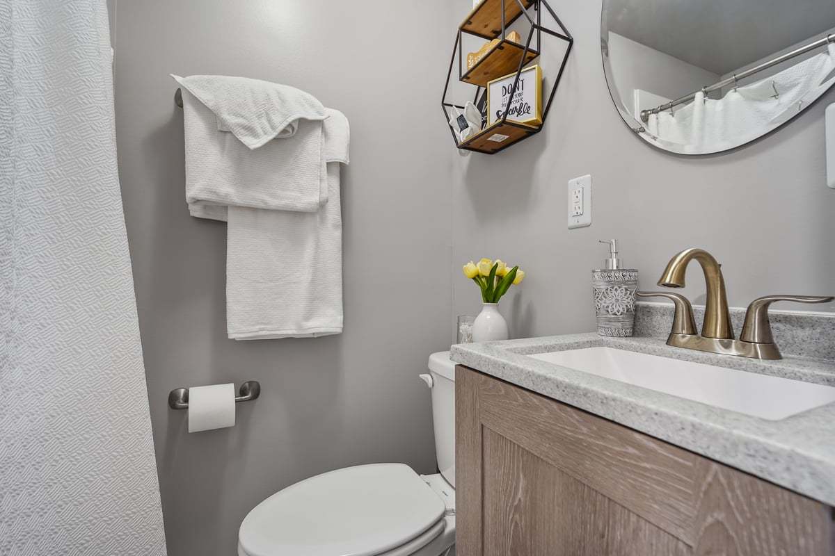 905 Dresser Drive Normal, IL 61761 - Photo 31 of 38 a bathroom with a sink a toilet and a mirror