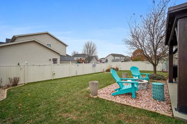 a view of a house with backyard porch and sitting area