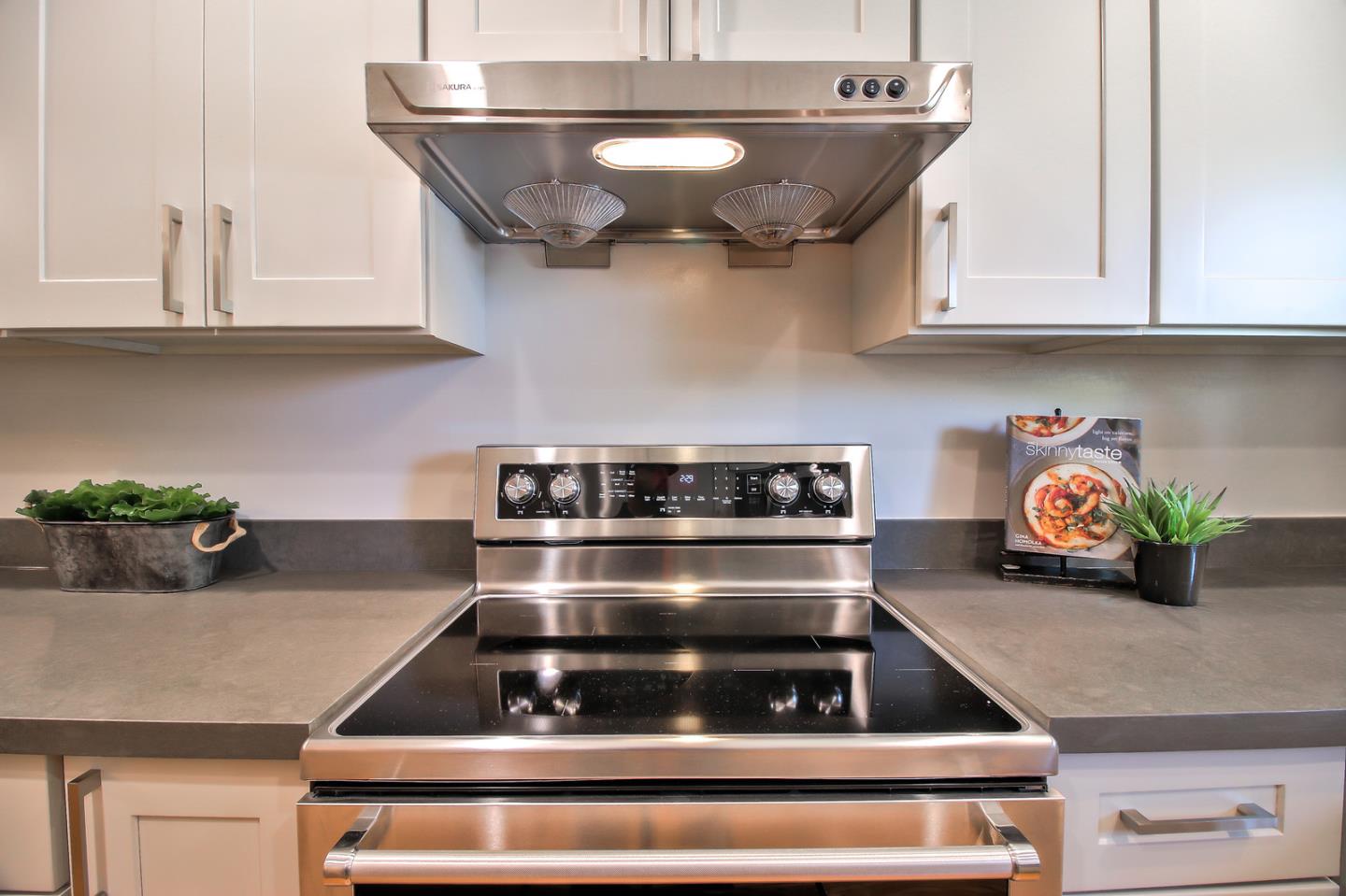 2128 Vía D'Este Campbell, CA 95008 - Photo 19 of 33 a kitchen with stainless steel appliances granite countertop a stove and a cabinets