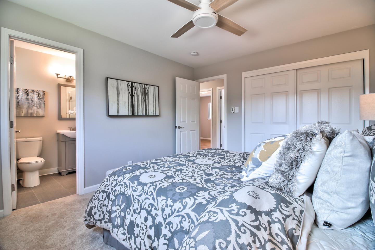 2128 Vía D'Este Campbell, CA 95008 - Photo 26 of 33 a bedroom with a large bed and a chandelier