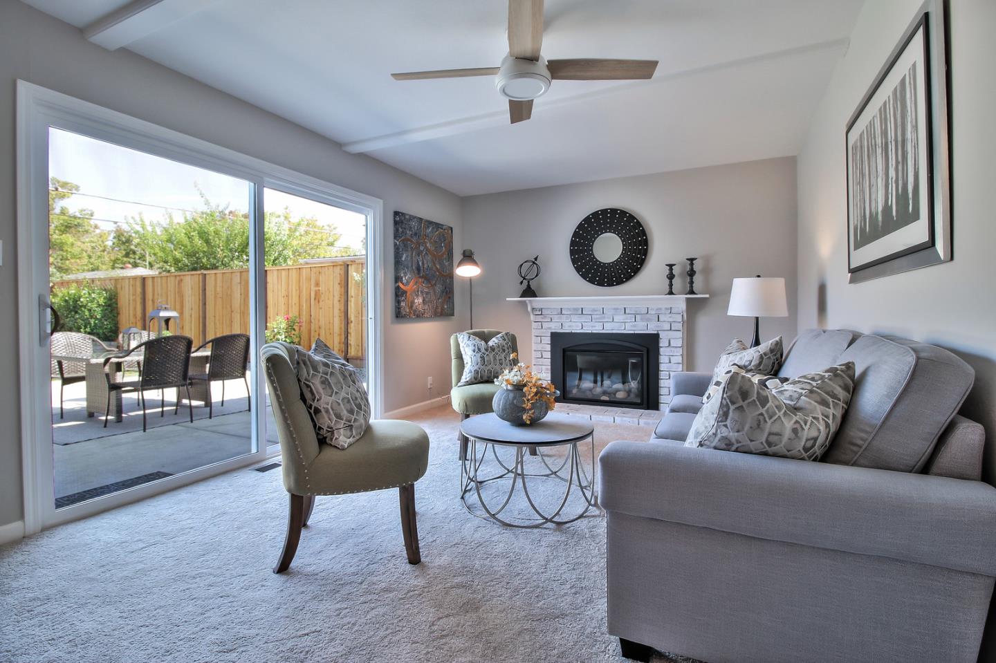 2128 Vía D'Este Campbell, CA 95008 - Photo 9 of 33 a living room with furniture a fireplace and a floor to ceiling window