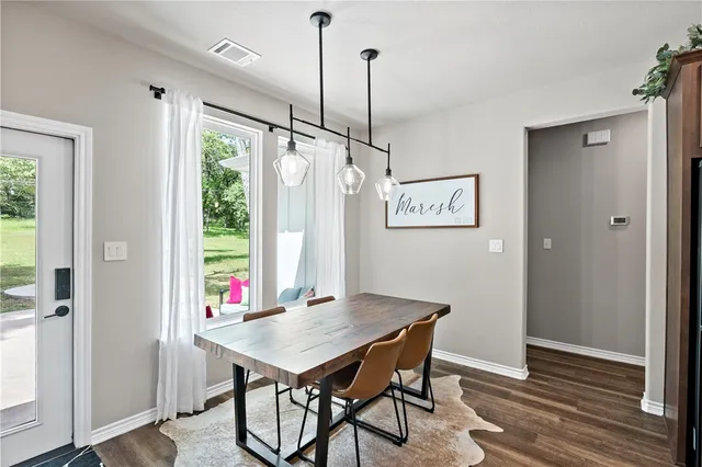 a kitchen with stainless steel appliances granite countertop a refrigerator stove and microwave