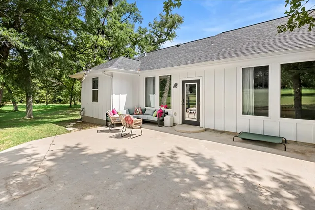 a bedroom with furniture and windows