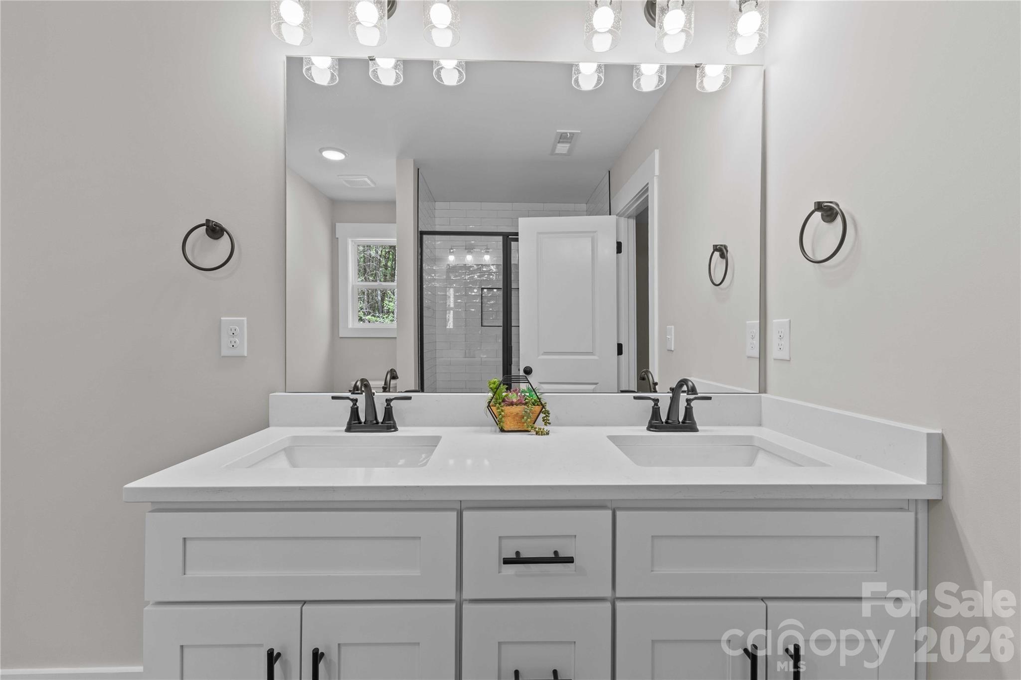 4581 Riverside Road Lancaster, SC 29720 - Photo 29 of 46 a bathroom with a sink double vanity and a mirror