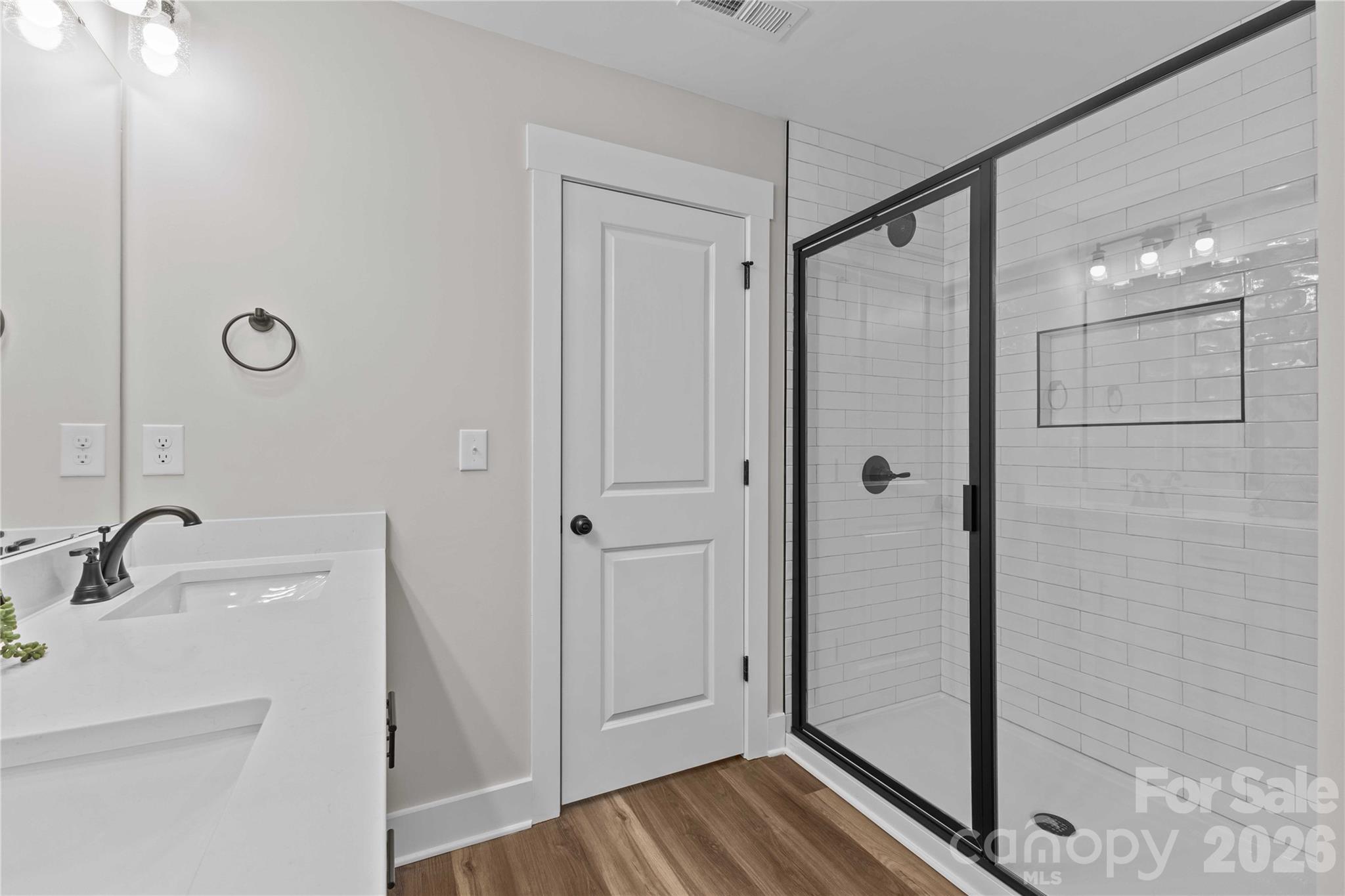 4581 Riverside Road Lancaster, SC 29720 - Photo 31 of 46 a bathroom with a shower sink and mirror