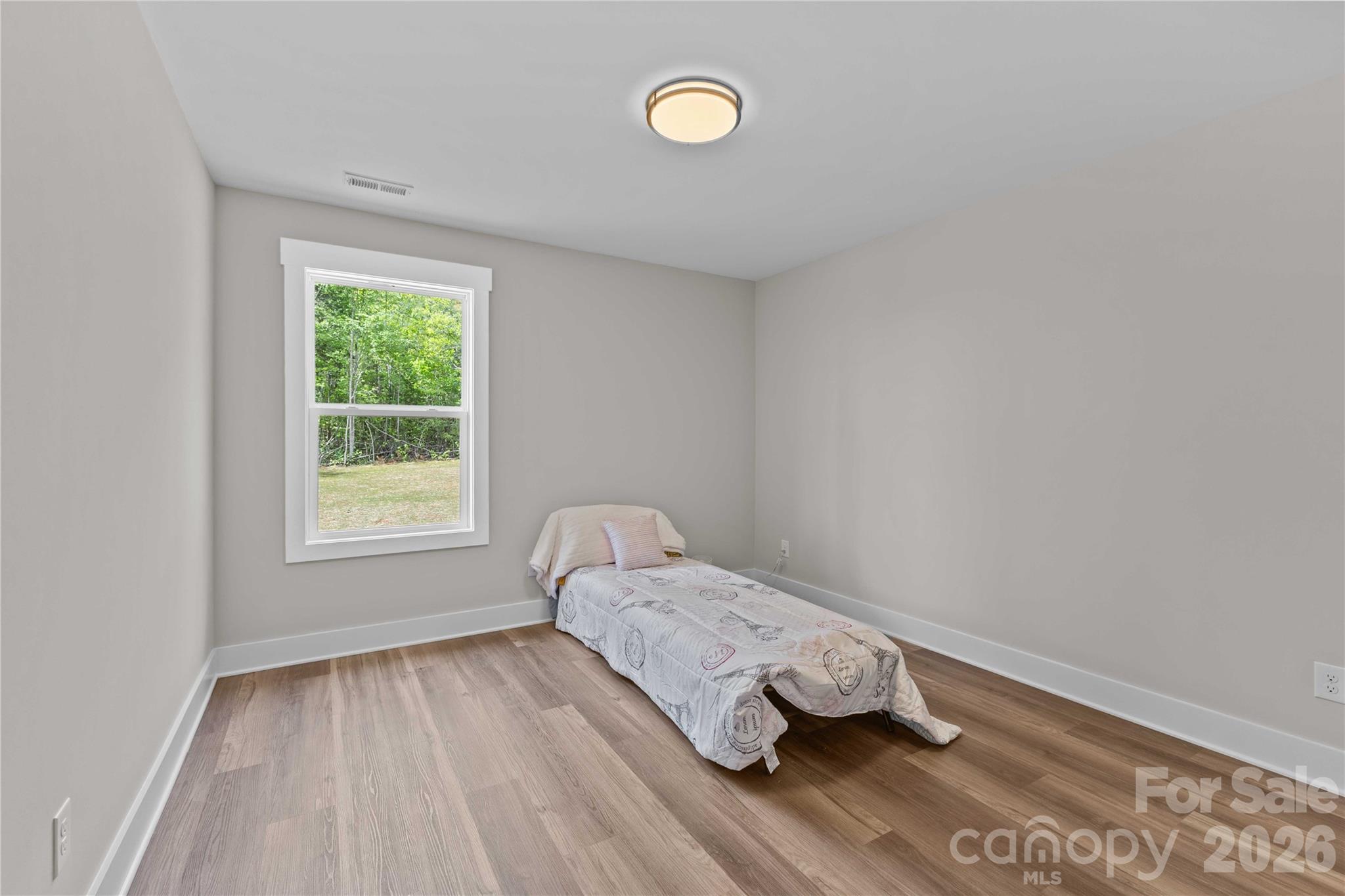 4581 Riverside Road Lancaster, SC 29720 - Photo 34 of 46 a room with a bed and a window
