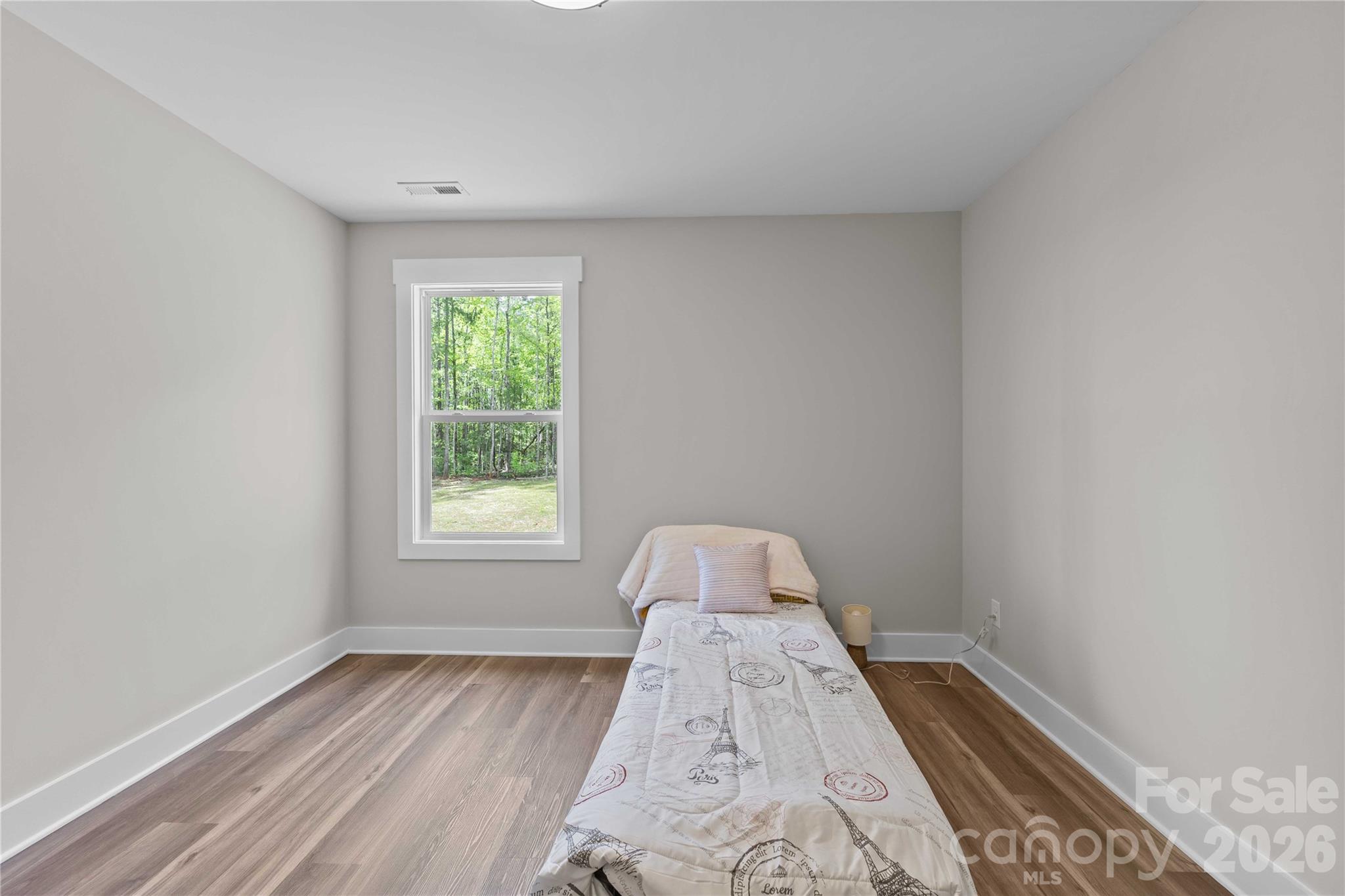4581 Riverside Road Lancaster, SC 29720 - Photo 35 of 46 a view of a bedroom with wooden floor and a window