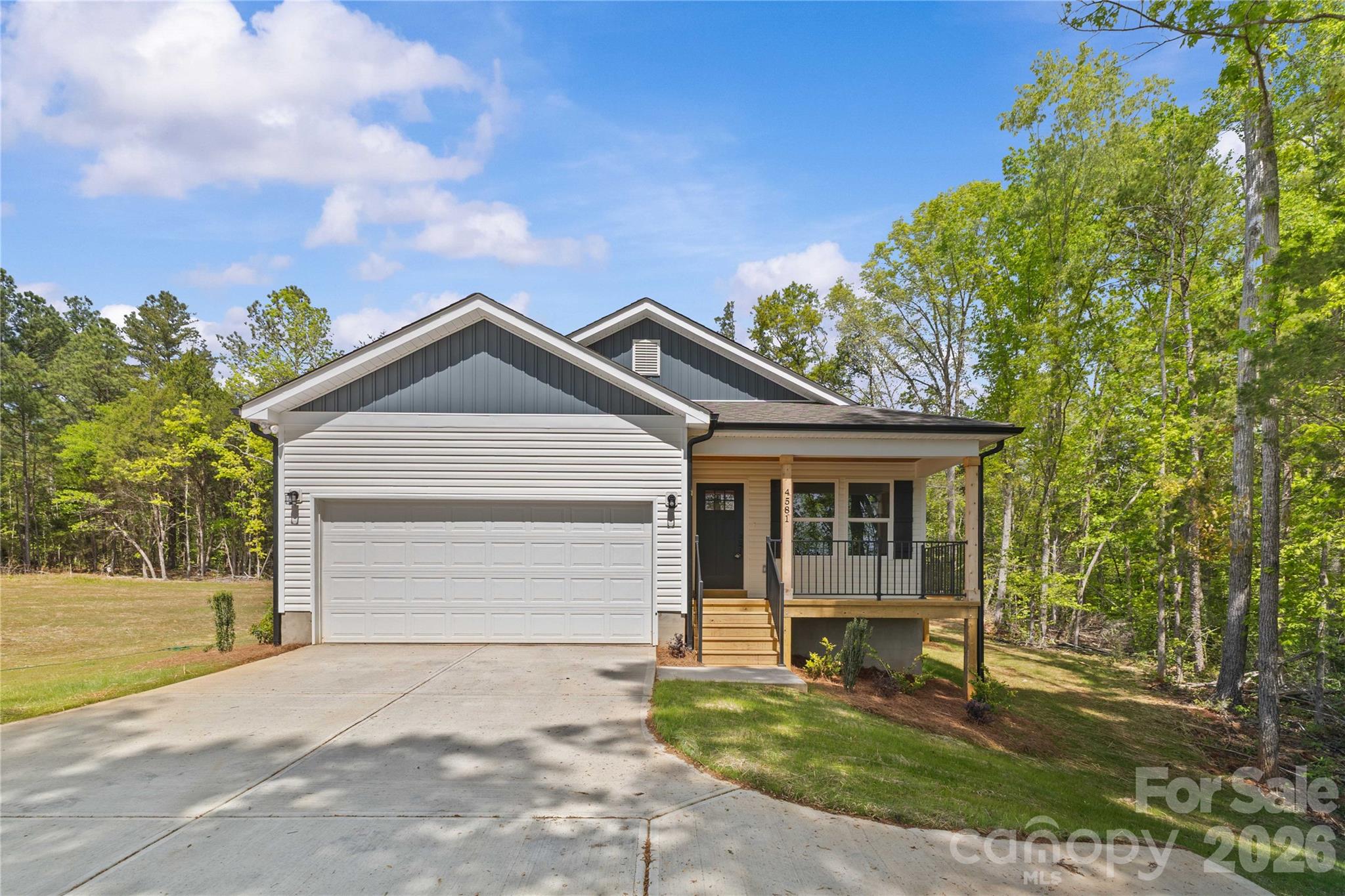4581 Riverside Road Lancaster, SC 29720 - Photo 44 of 46 a front view of a house with a yard and garage