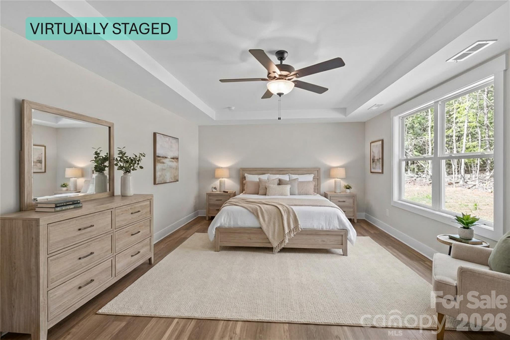 4581 Riverside Road Lancaster, SC 29720 - Photo 45 of 46 a bedroom with a large bed and a chandelier