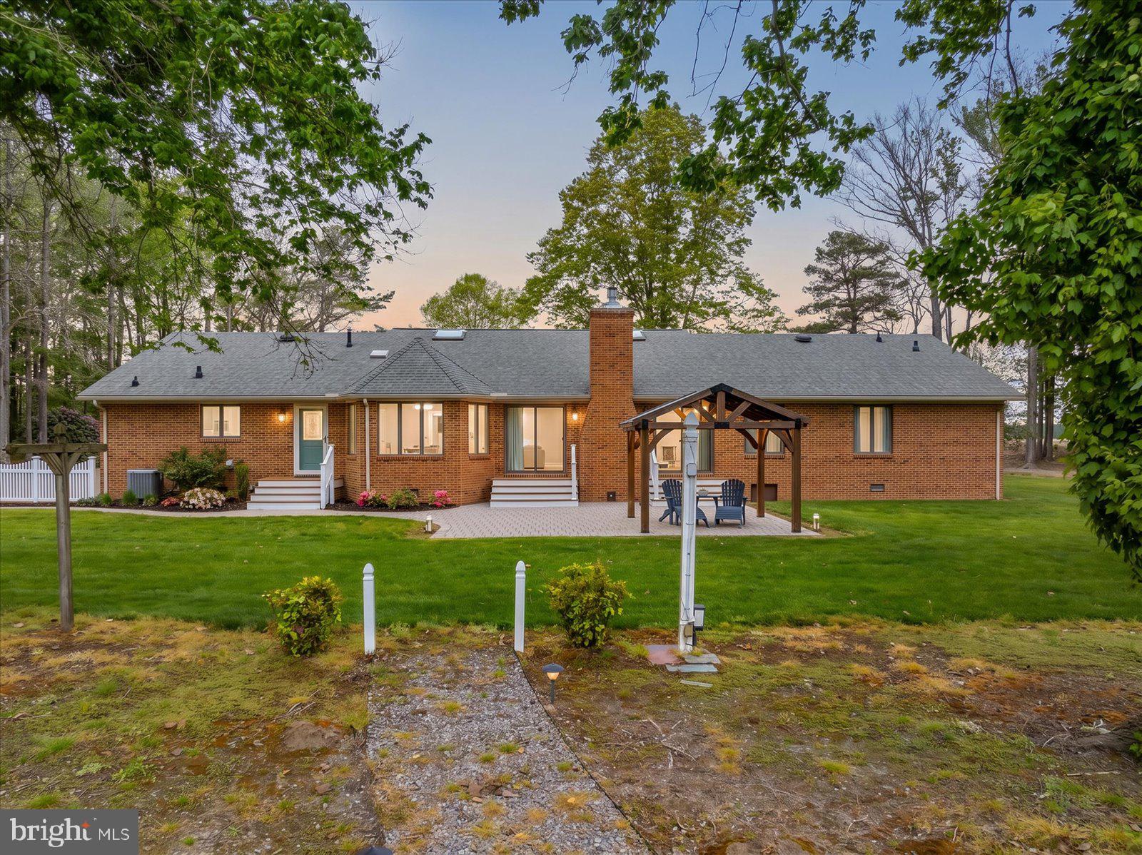 33915 Shockley Road Parsonsburg, MD 21849 - Photo 2 of 125 Charming brick home with lush greenery.