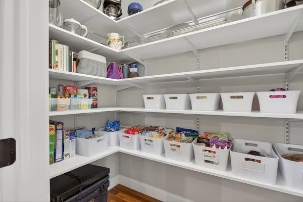 a bathroom with a granite countertop sink toilet a mirror a vanity and shower
