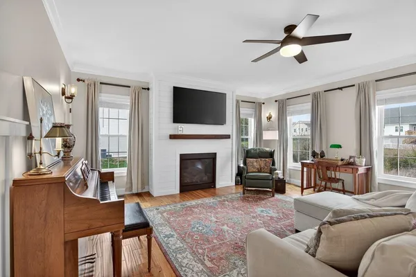 a view of a dining room with furniture and wooden floor