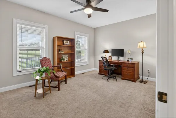 a view of a livingroom with furniture and windows