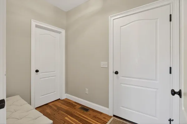 a bathroom with a granite countertop sink a toilet and shower