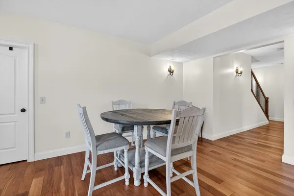 a bedroom with a bed and a chair