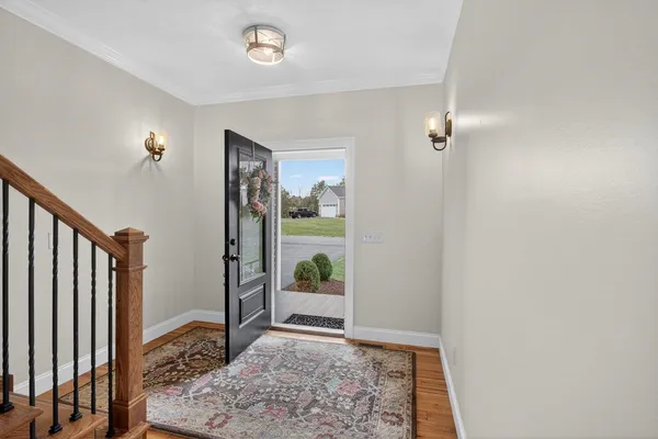 a kitchen with stainless steel appliances granite countertop a refrigerator stove and sink