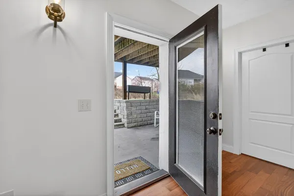 a front view of a house with a yard table and chairs