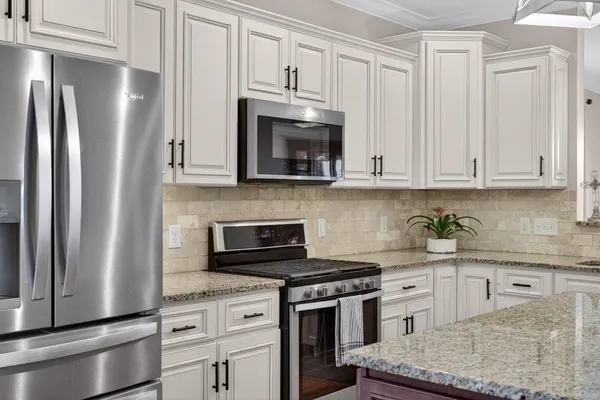 a living room with furniture fireplace and flat screen tv