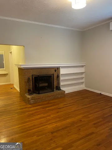a view of wooden floor and cabinet