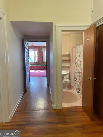 a view of a livingroom with an empty space and a window