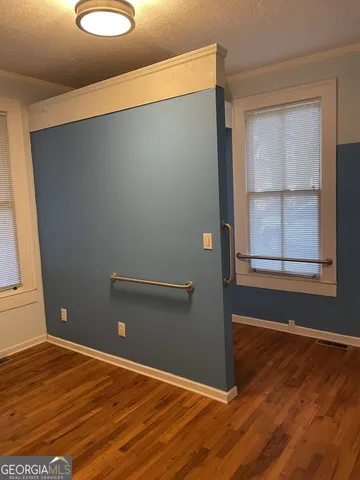 a view of a livingroom with wooden floor