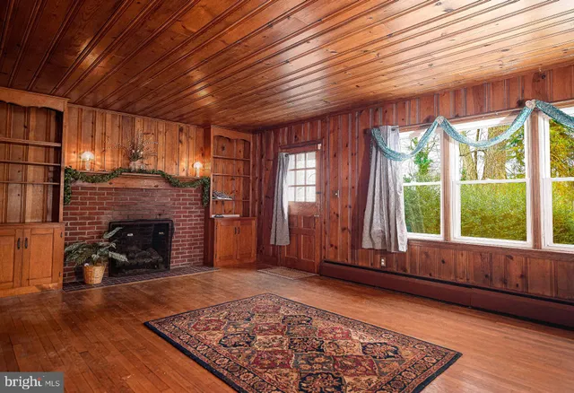 a view of staircase with wooden floor and a window
