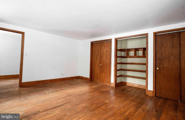 a view of a road with a building in the background