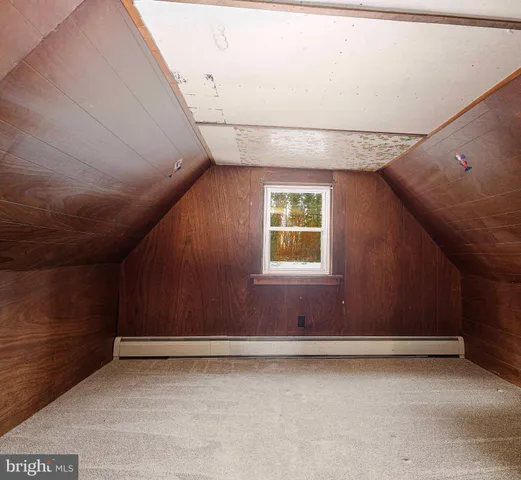 a backyard of a house with swimming pool table and chairs