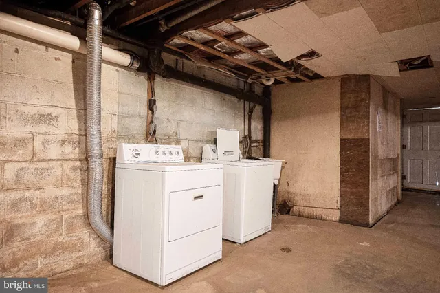 a view of a house with backyard porch and sitting area