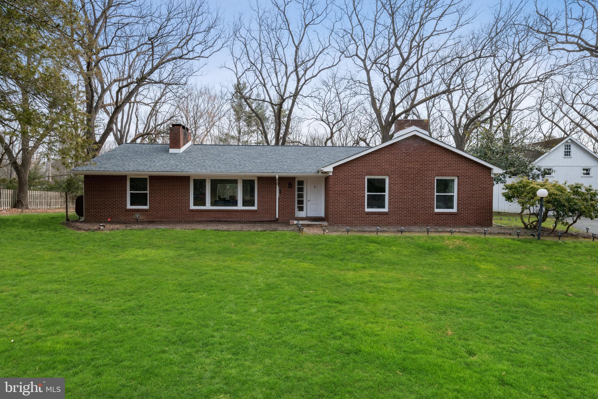 184 Carter Road Princeton, NJ 08540 - Photo 14 of 34 a front view of a house with a garden